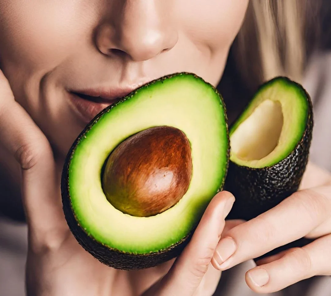 Freshness Of Avocados - A lady smelling a well ripen avocado